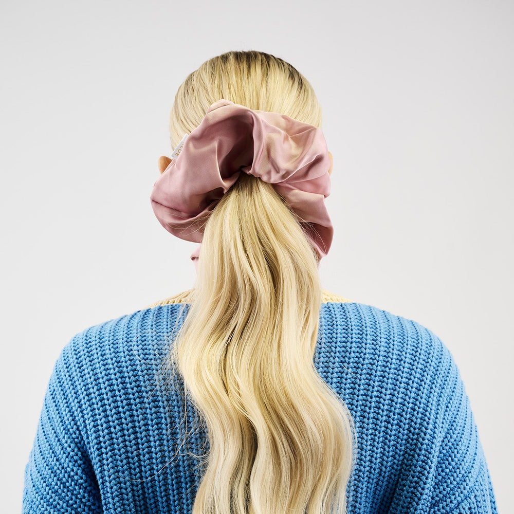 Pink scrunchie on a white background
