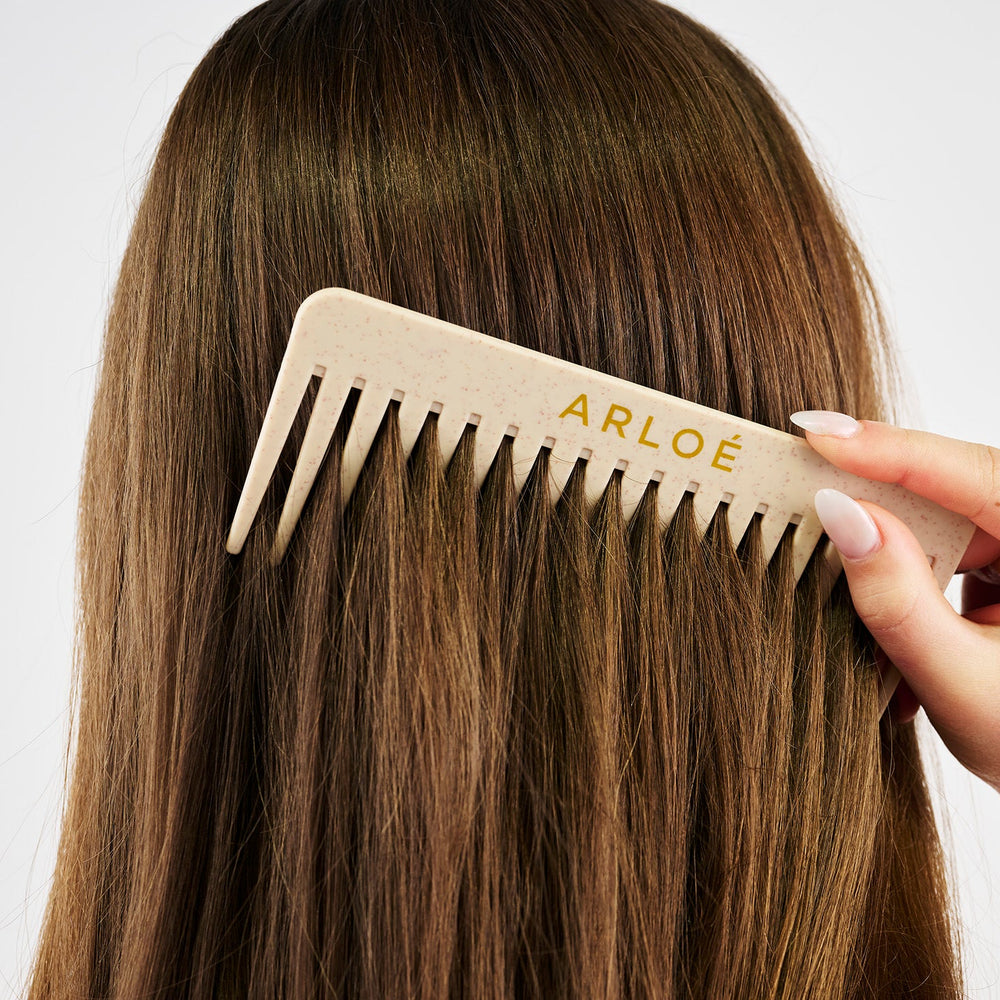 Comb with 'ARLOE' branding on a white background