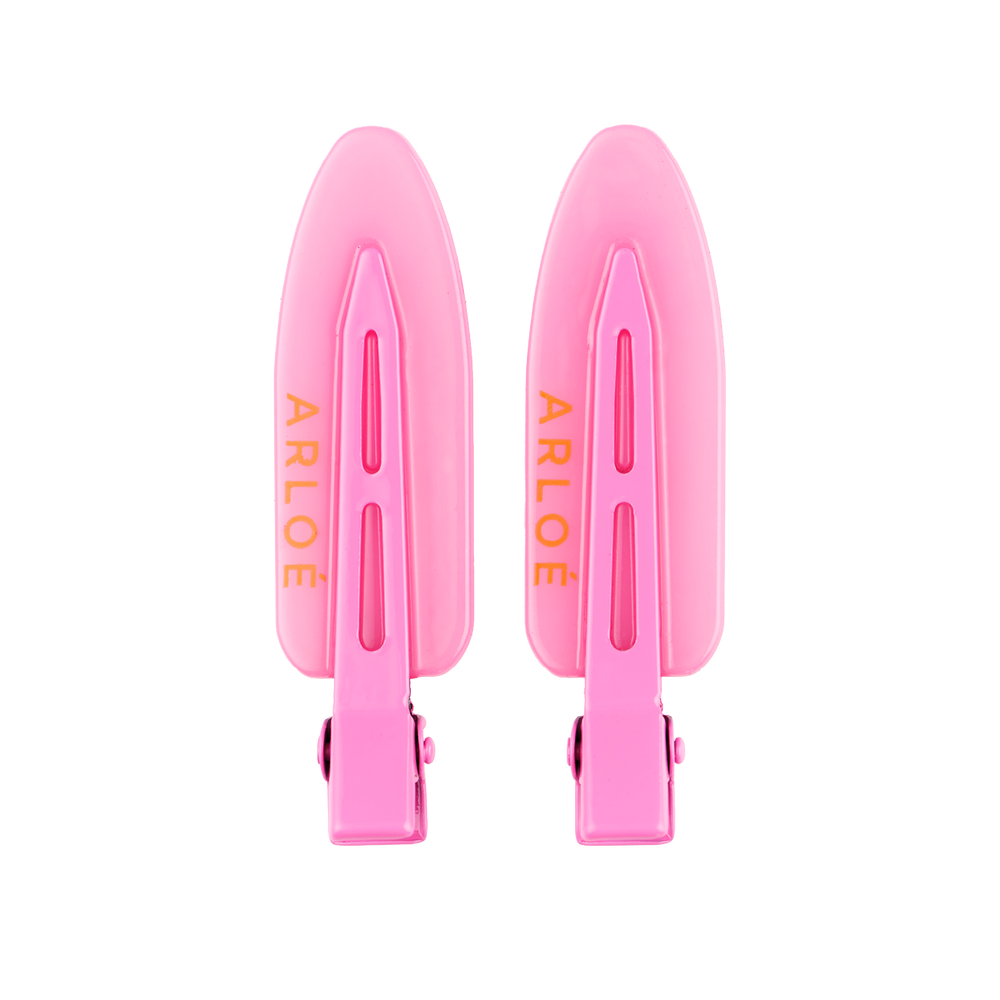 Two pink hair clips with 'ARLOE' branding on a white background