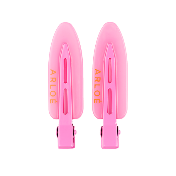 Two pink hair clips with 'ARLOE' branding on a white background