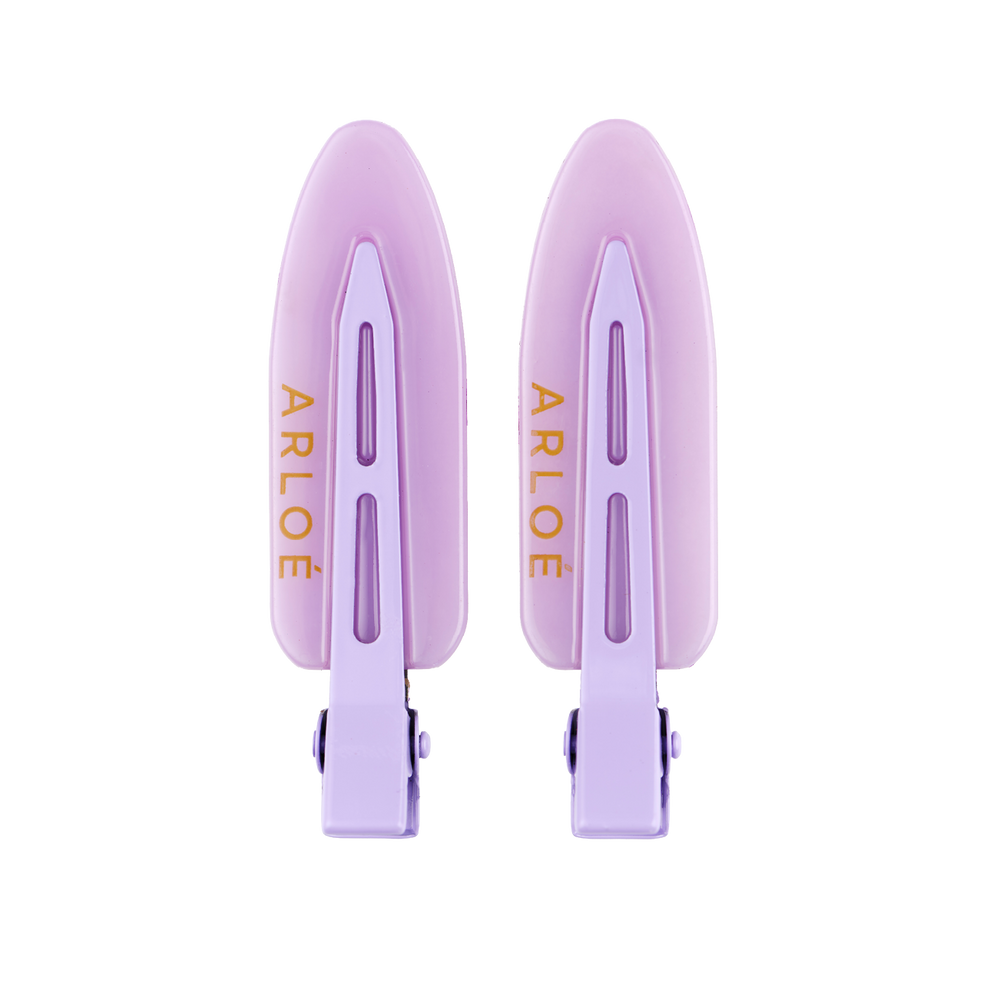 Two purple hair clips with ARLOE branding on a white background