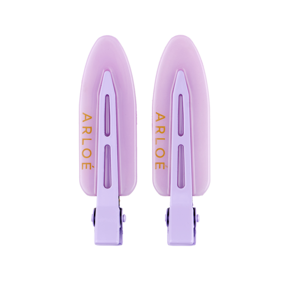 Two purple hair clips with ARLOE branding on a white background