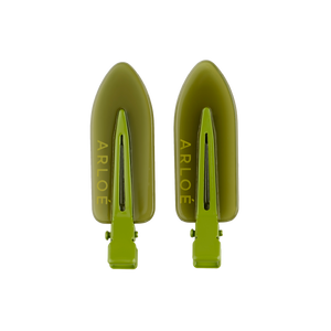 Two green hair clips with 'ARLOE' branding on a white background