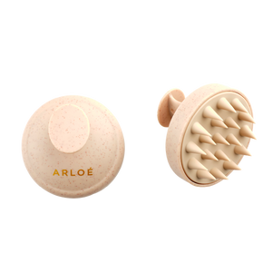 Two beige scalp massagers with 'ARLOE' branding on a white background