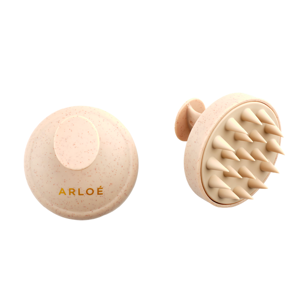 Two beige scalp massagers with 'ARLOE' branding on a white background