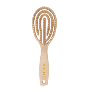 Hairbrush with rounded handle and textured head on a white background, branded 'ARLOE'.