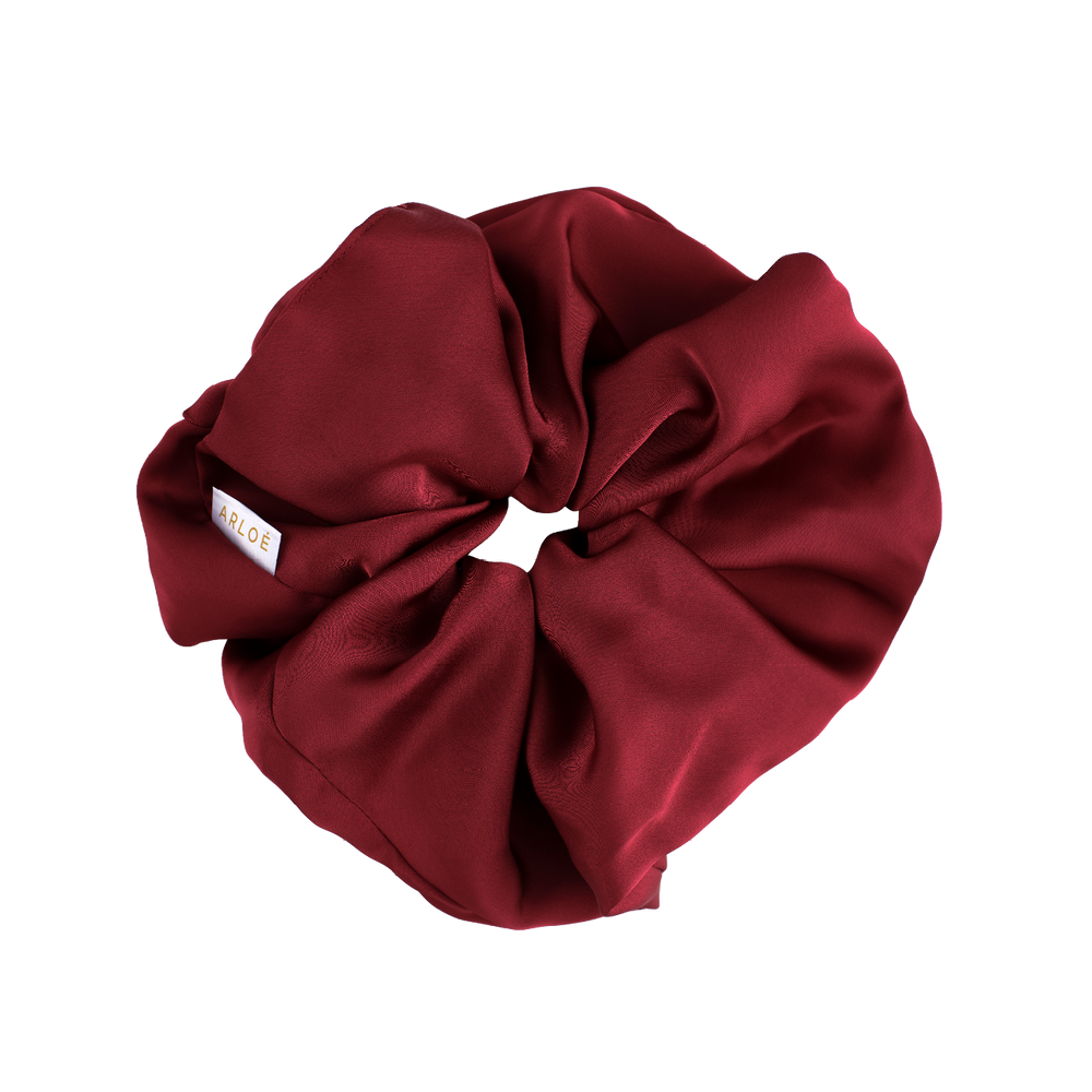 Red scrunchie on a white background