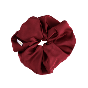 Red scrunchie on a white background