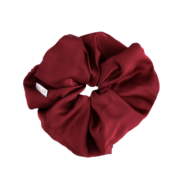 Red scrunchie on a white background