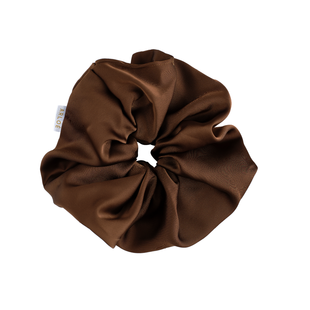 Brown scrunchie on a white background