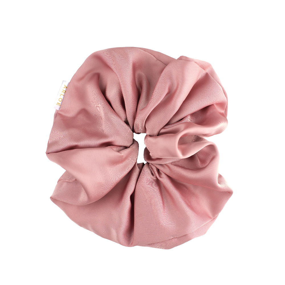 Pink scrunchie on a white background