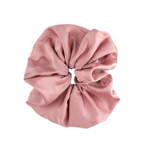 Pink scrunchie on a white background