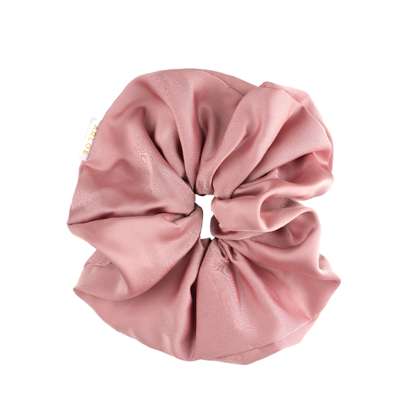 Pink scrunchie on a white background