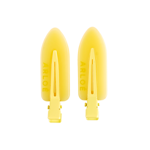Two yellow ARLOE products on a white background