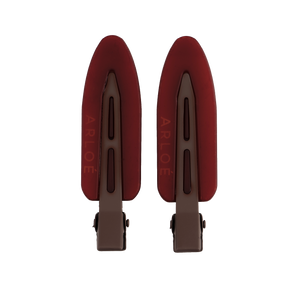 Two red shoe trees with 'ARLOE' branding on a white background