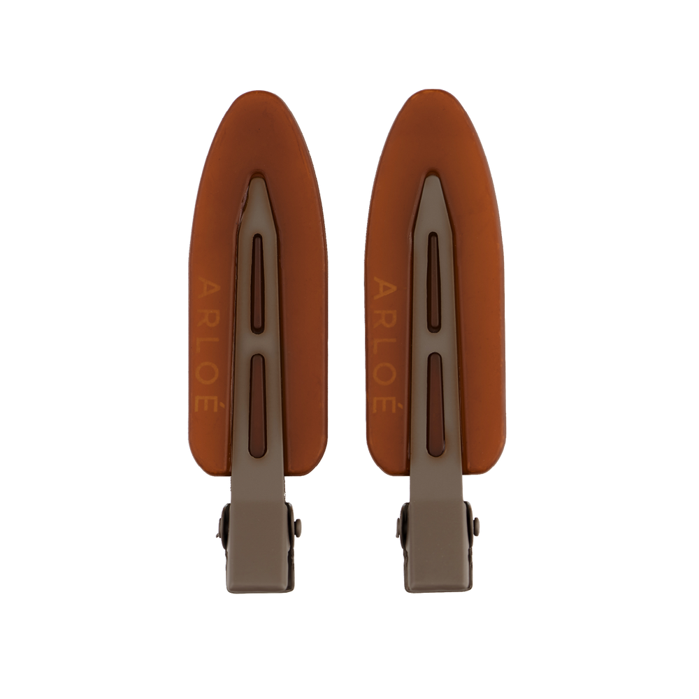 Two brown hair clips with 'ARLOE' branding on a white background