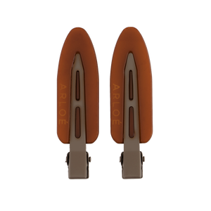 Two brown hair clips with 'ARLOE' branding on a white background